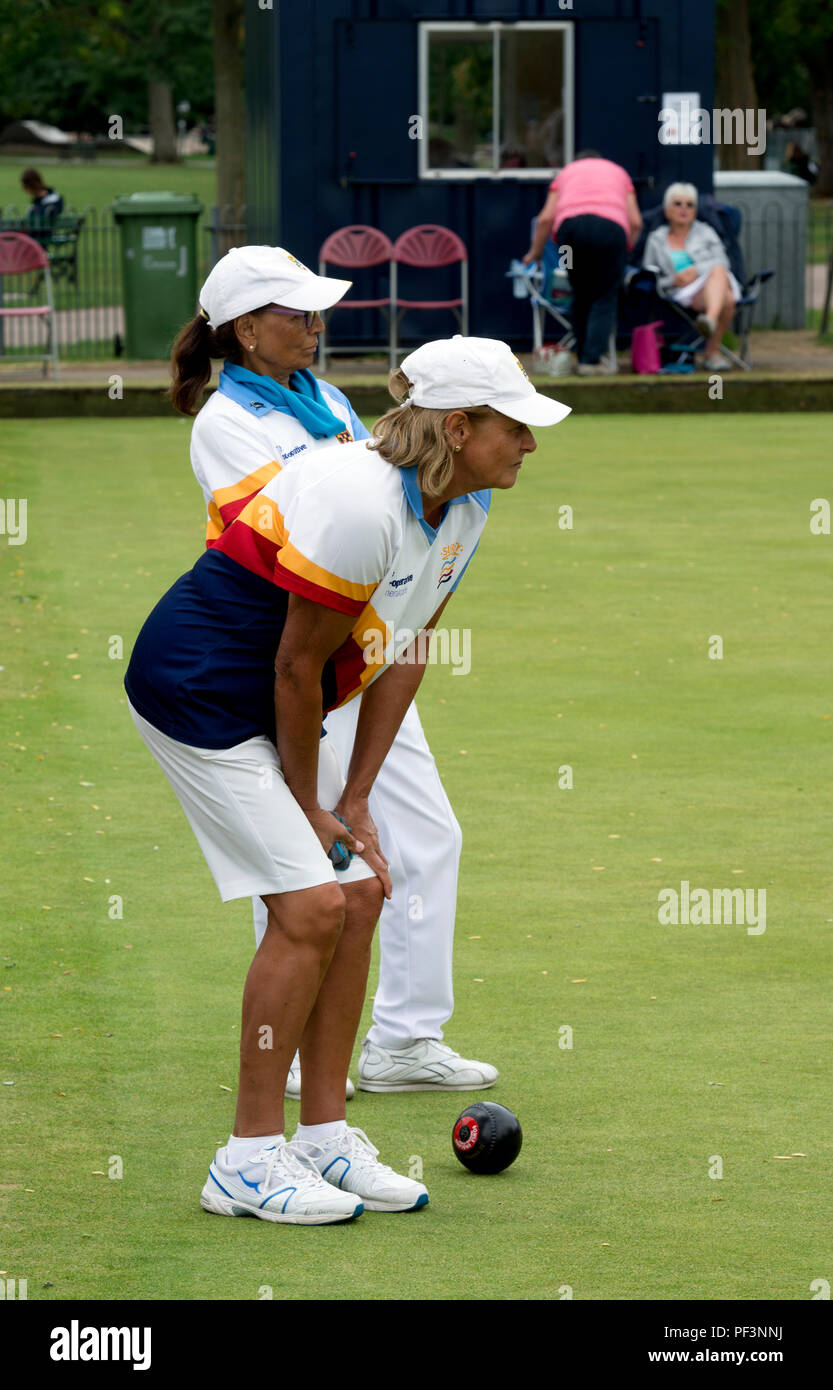 Players watching a delivery at the national women`s lawn bowls championships, Leamington Spa, UK Stock Photo